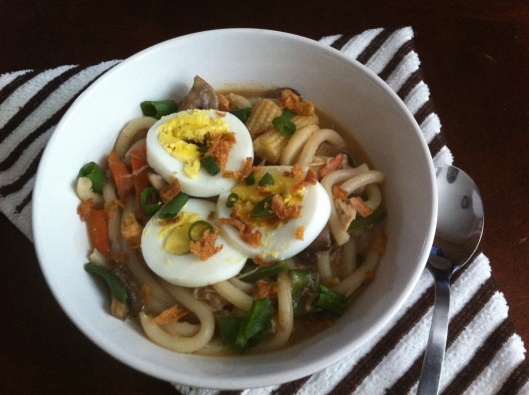 Chicken & Bacon Udon Noodles Topped with sliced eggs, scallions and fried onions